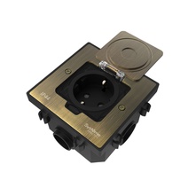 Изображение товара Systeme Elecrtic MultiDesk Античная латунь Лючок с розеткой 2К+З, 16А/250В, IP44 с монтажной коробкой для бетонных полов, тип MDK21